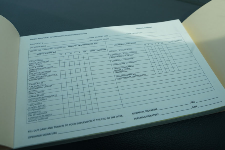 Image of the Gaines and Company Equipment Inspection Book with text in both English and Spanish