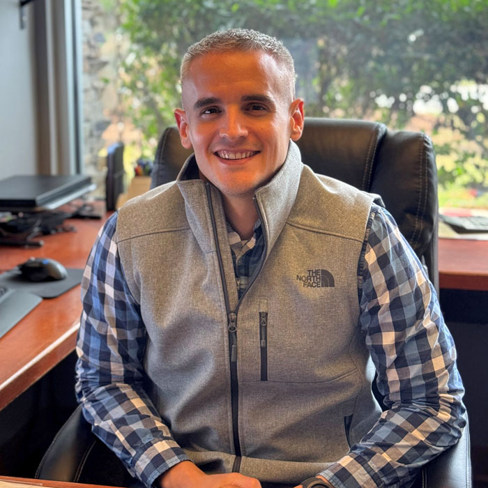 Gaines and Company’s Project Manager & Estimator Jake Grammer at his desk in the North Carolina office